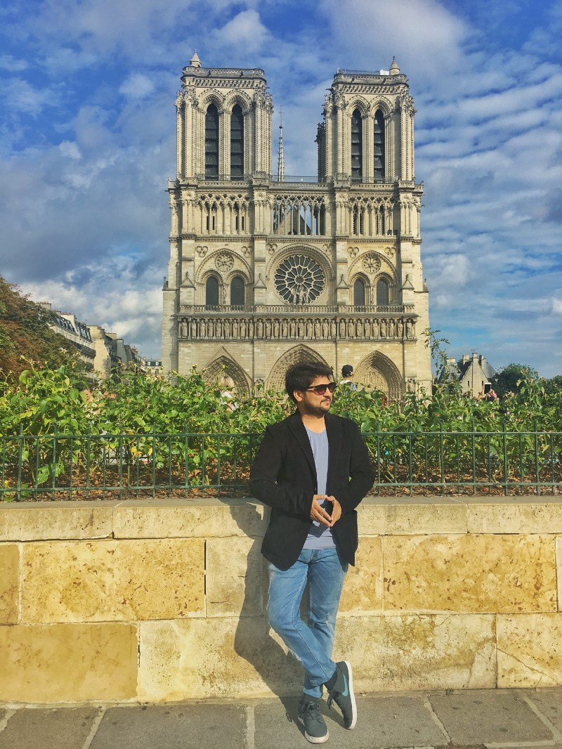 Utpal Vaishnav standing near Notre-Dame in Paris.